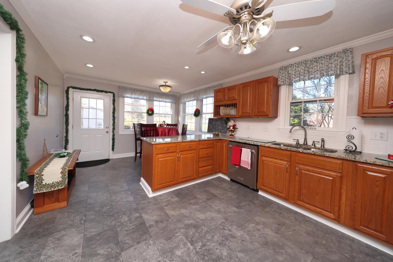 167 Henkel Road Waynesboro, VA 22980 - Photo 14 of 53 a large kitchen with stainless steel appliances granite countertop a sink dishwasher a stove and a refrigerator with wooden cabinets