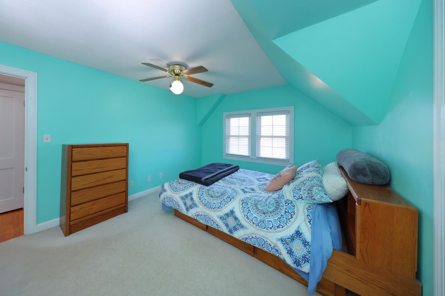 167 Henkel Road Waynesboro, VA 22980 - Photo 35 of 53 a bedroom with a bed and a chandelier