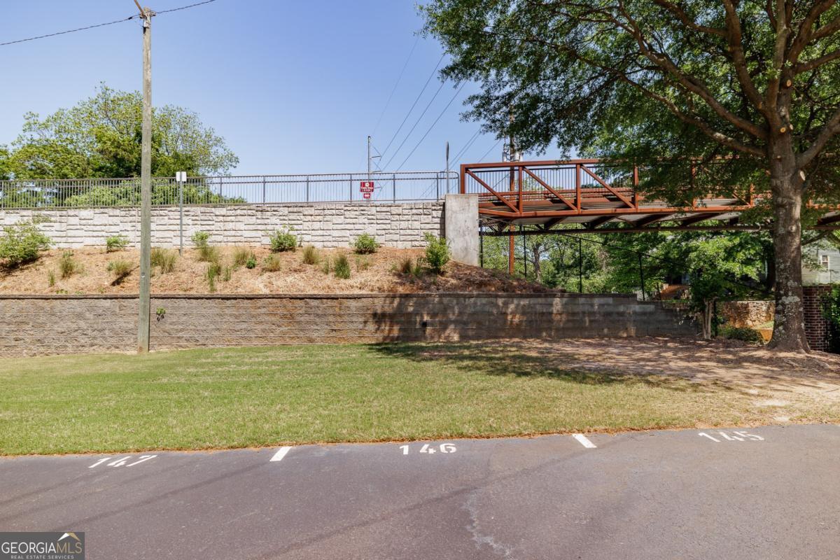 225 Oak Street, Unit 146 Athens, GA 30601 - Photo 16 of 23 a view of a swimming pool with a lawn chairs under an umbrella