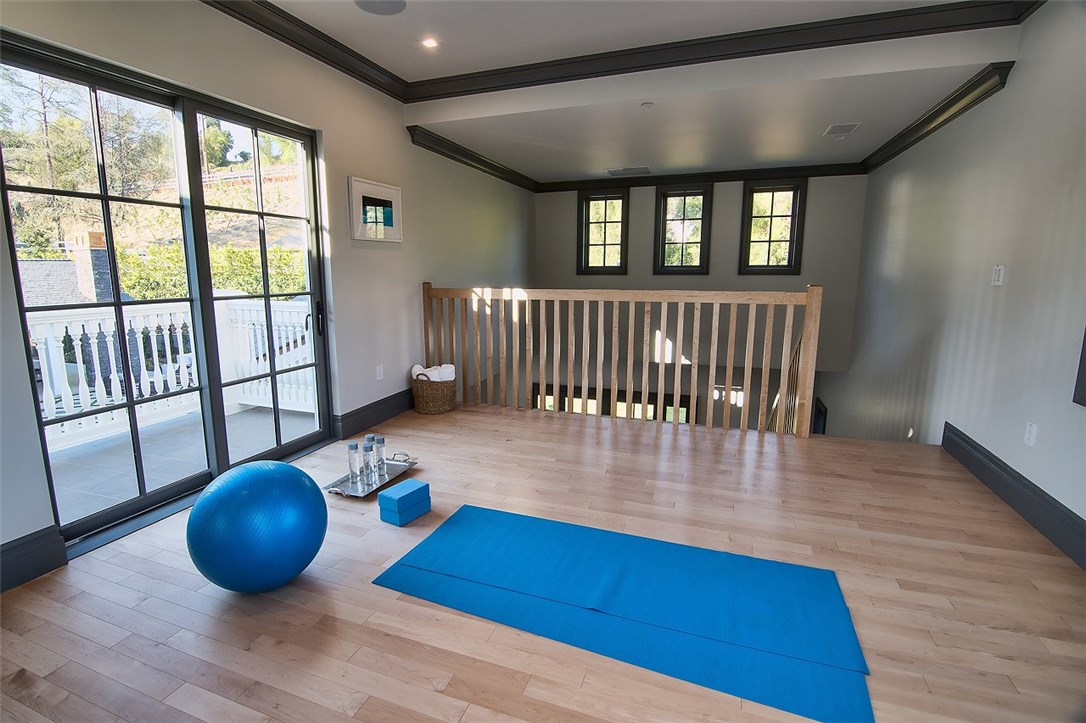 5546 Jed Smith Road Hidden Hills, CA 91302 - Photo 22 of 73 a view of a room with wooden floor and windows