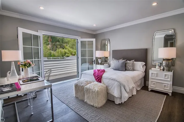 a view of kitchen island dining room wooden floor and living room