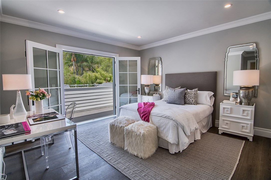 5546 Jed Smith Road Hidden Hills, CA 91302 - Photo 32 of 73 a bedroom with a bed and wooden floor