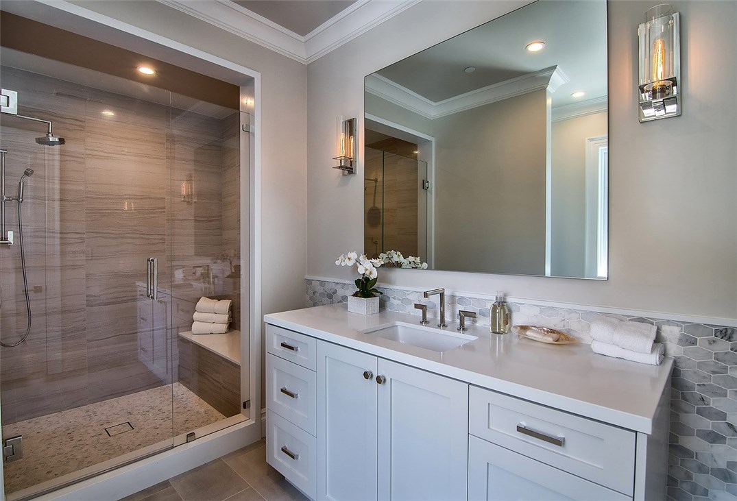 5546 Jed Smith Road Hidden Hills, CA 91302 - Photo 34 of 73 a bathroom with a shower sink and mirror