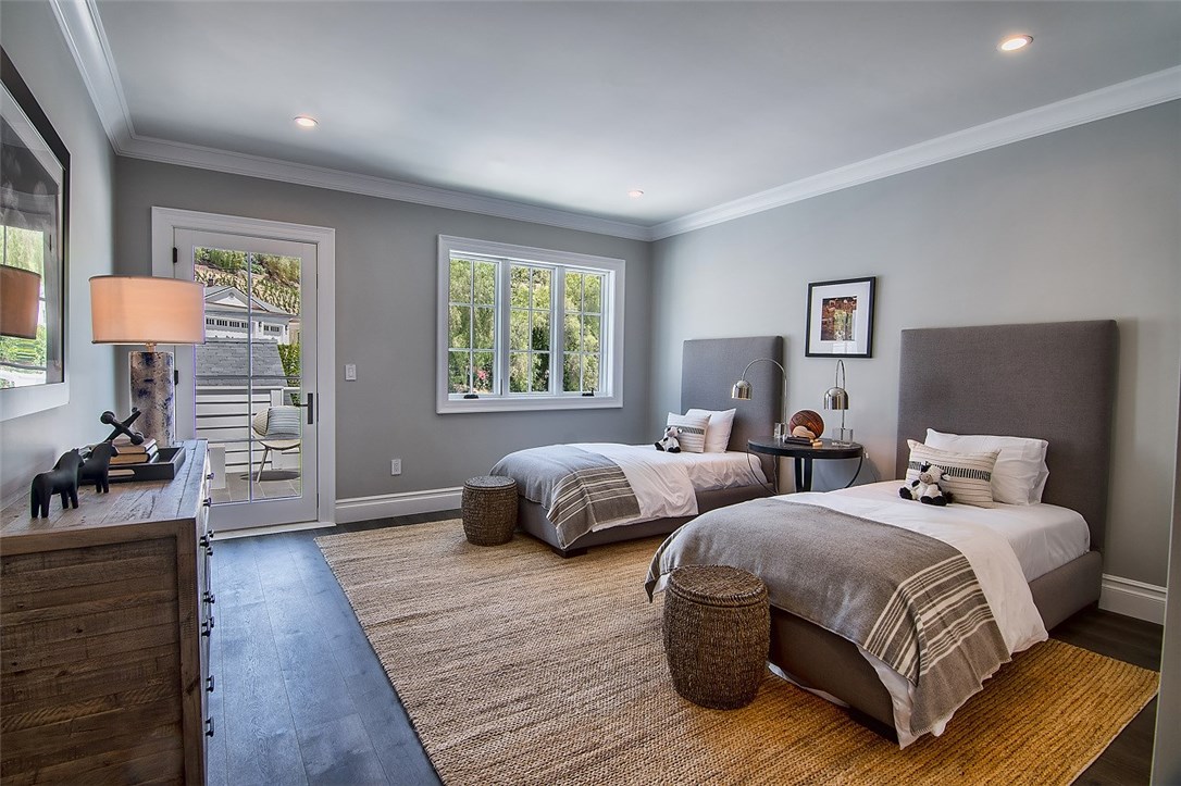 5546 Jed Smith Road Hidden Hills, CA 91302 - Photo 35 of 73 a bedroom with two beds and a chair