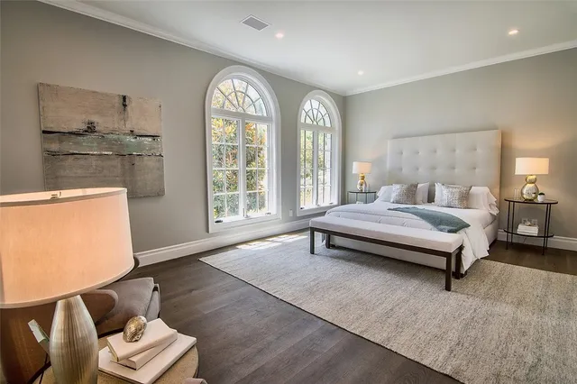 a view of a swimming pool with outdoor seating and plants