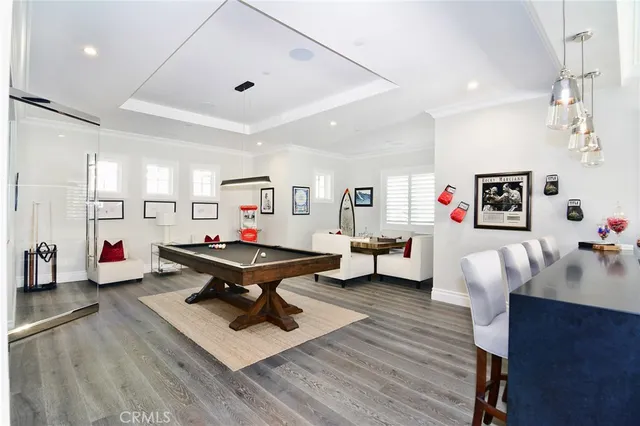 a view of a patio with swimming pool table and chairs