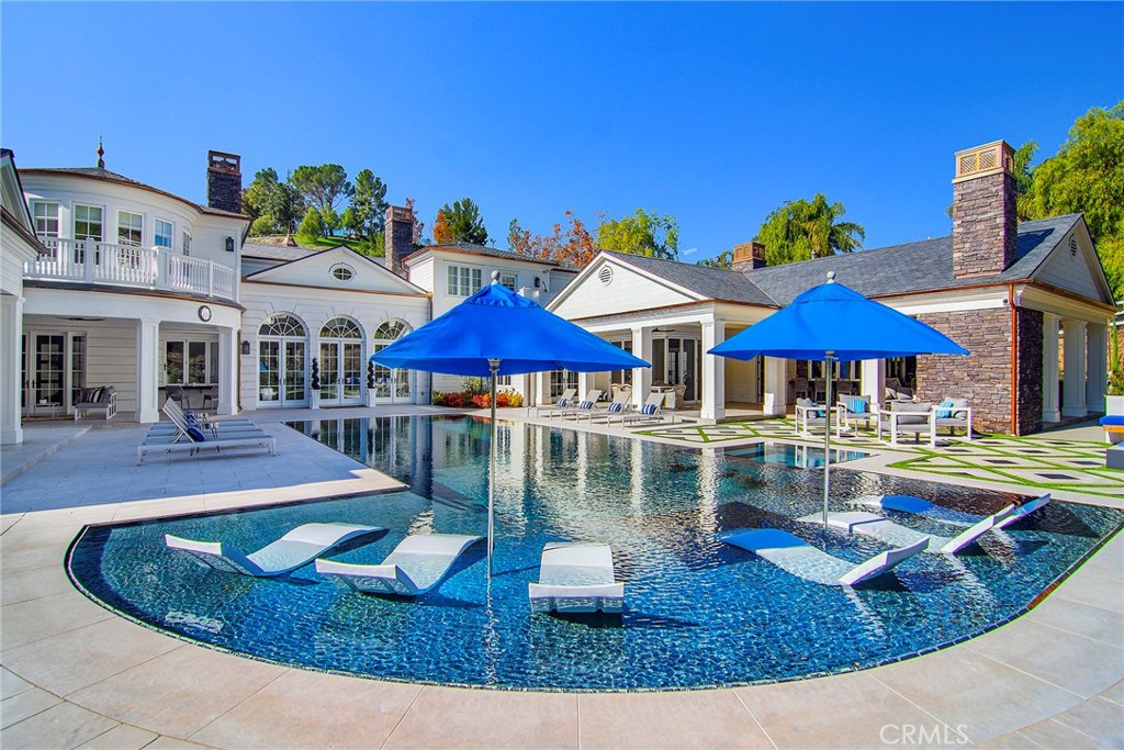 5546 Jed Smith Road Hidden Hills, CA 91302 - Photo 46 of 73 a view of a house with swimming pool and sitting area