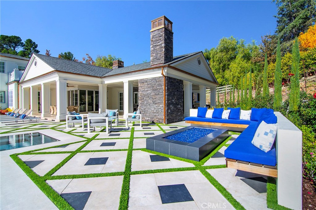 5546 Jed Smith Road Hidden Hills, CA 91302 - Photo 55 of 73 a view of a patio with swimming pool table and chairs