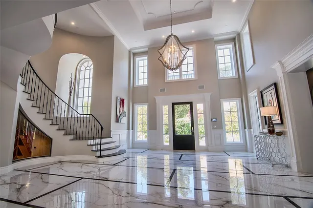 a living room with furniture a fireplace and a large window