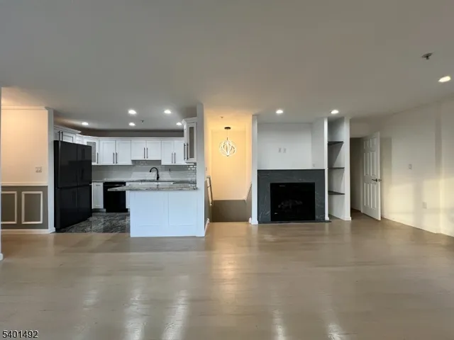 a view of kitchen with kitchen island sink and stove