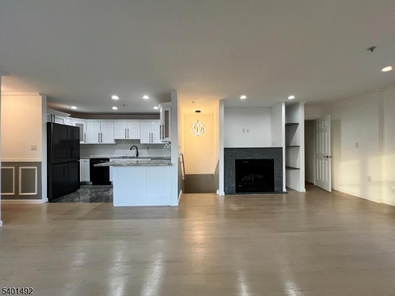 614 Fairview Avenue, Unit E Fairview, NJ 07022 - Photo 2 of 14 a view of kitchen with kitchen island sink and stove