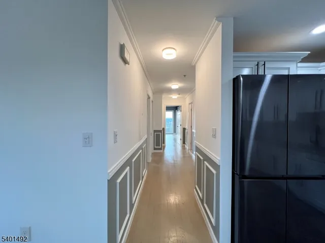 a view of a refrigerator and an empty room