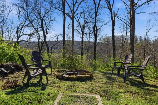 a view of a backyard with sitting area
