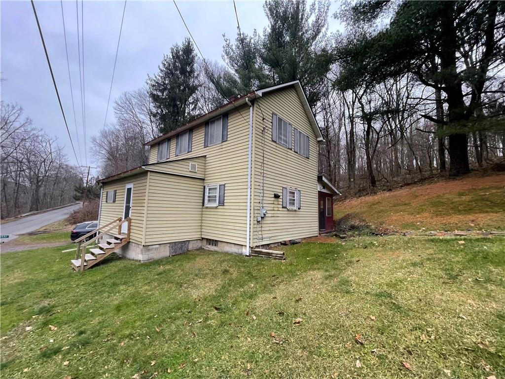4551 Hollow Road New Castle, PA 16101 - Photo 1 of 21 a view of a backyard with a small cabin