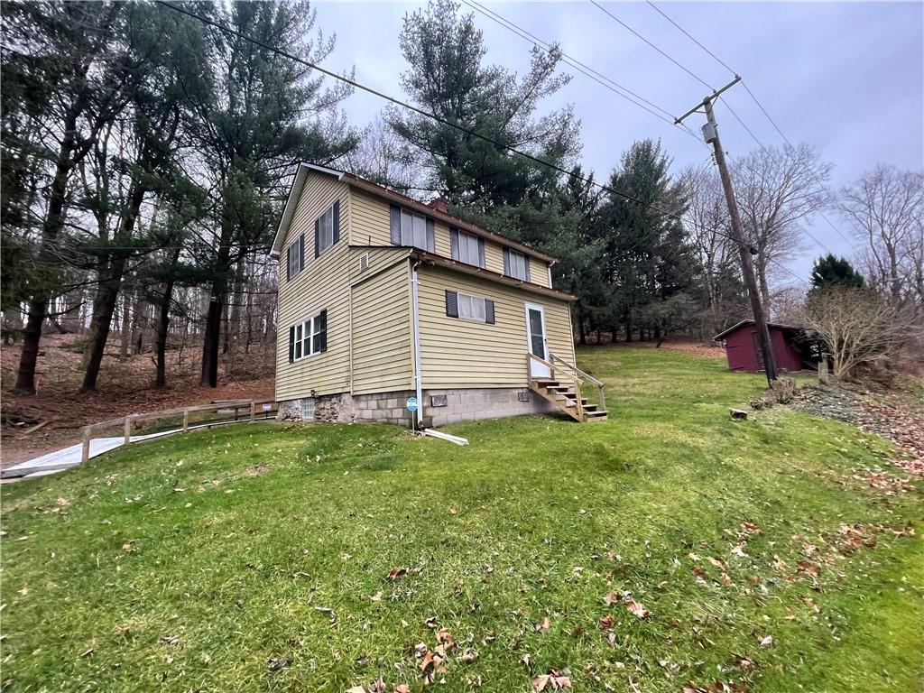 4551 Hollow Road New Castle, PA 16101 - Photo 2 of 21 a backyard of a house with table and chairs