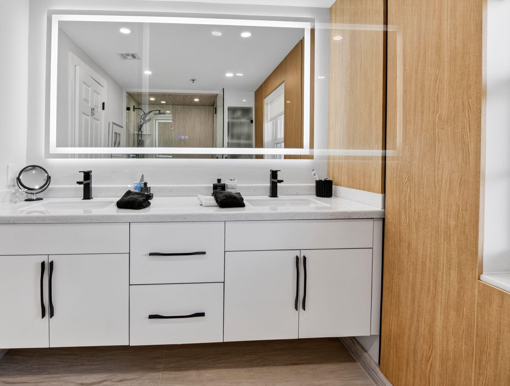 950 De Soto Road, Unit 5A Boca Raton, FL 33432 - Photo 61 of 98 a bathroom with a sink and a mirror