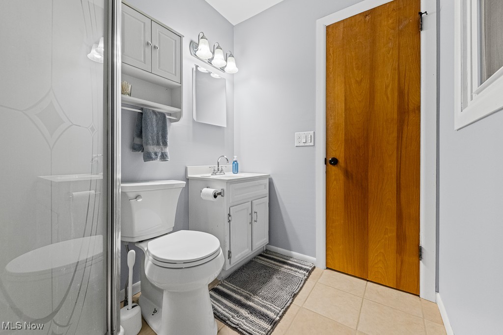 4000 Kenneth Road Stow, OH 44224 - Photo 28 of 50 Bathroom with vanity, a shower with shower door, and tile patterned flooring