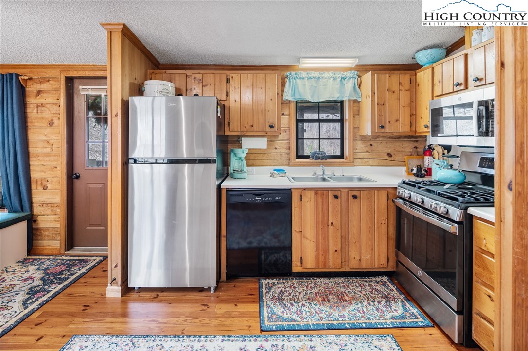 2408 Todd Railroad Grade Road Todd, NC 28684 - Photo 6 of 46 a kitchen with stainless steel appliances granite countertop a refrigerator stove and sink