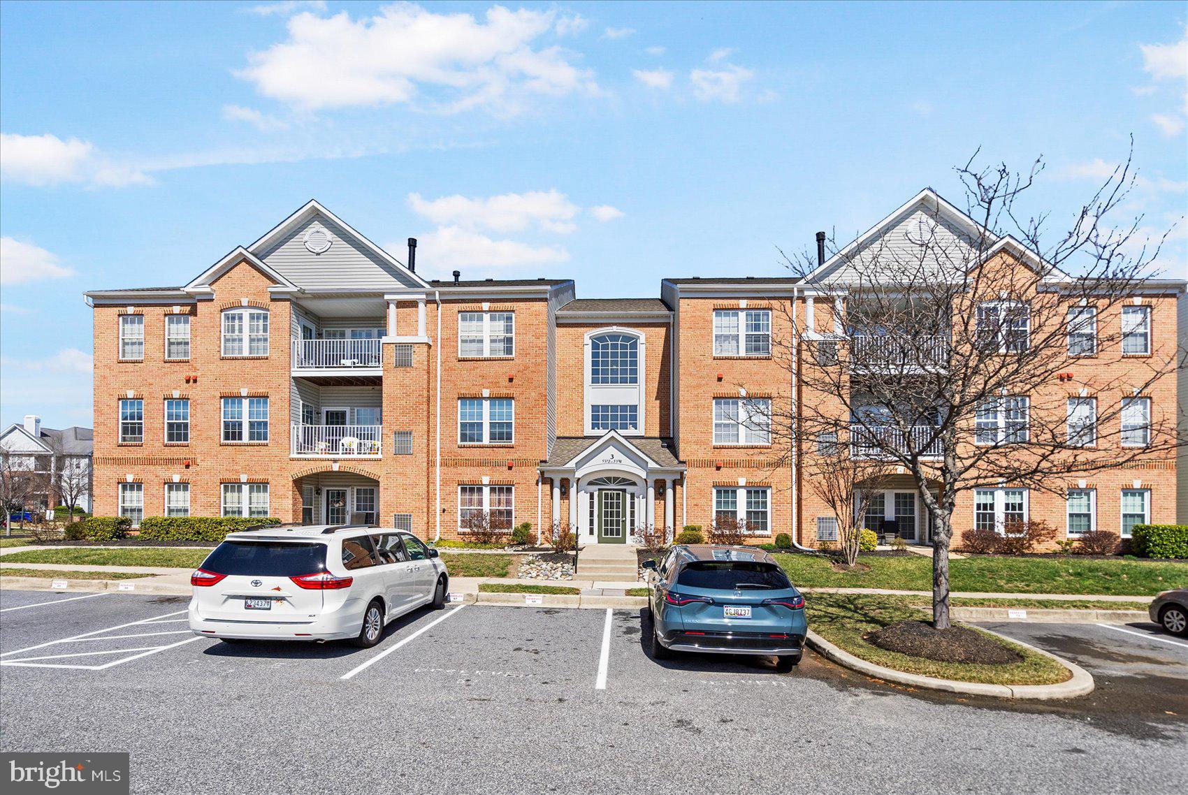 a car parked in front of a brick house