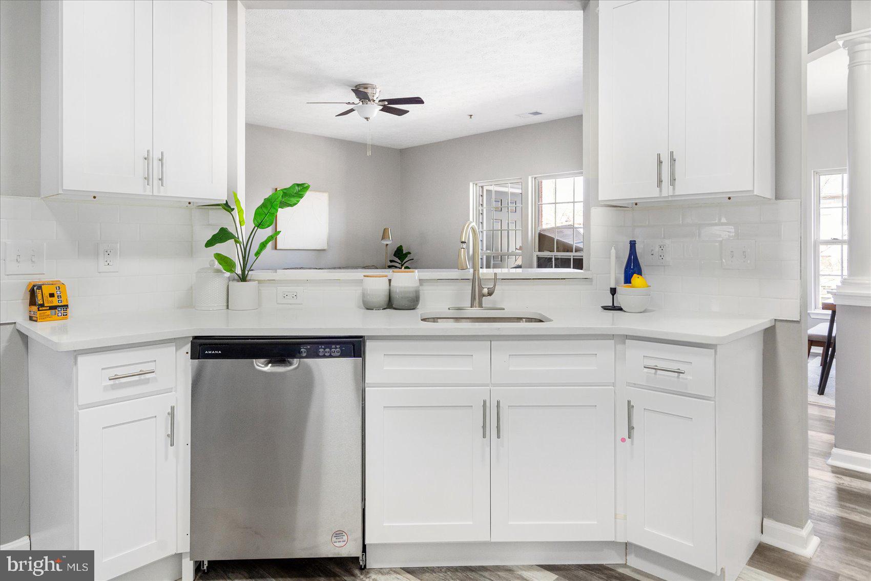5386 Glenthorne Court, Unit 5386 Baltimore, MD 21237 - Photo 15 of 36 a kitchen with white cabinets and appliances
