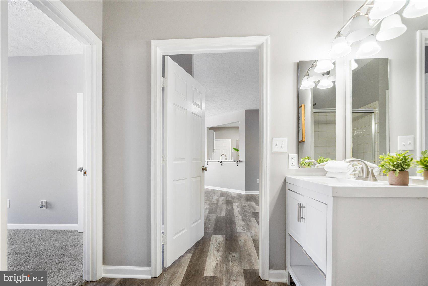 5386 Glenthorne Court, Unit 5386 Baltimore, MD 21237 - Photo 19 of 36 a room with a sink and a mirror
