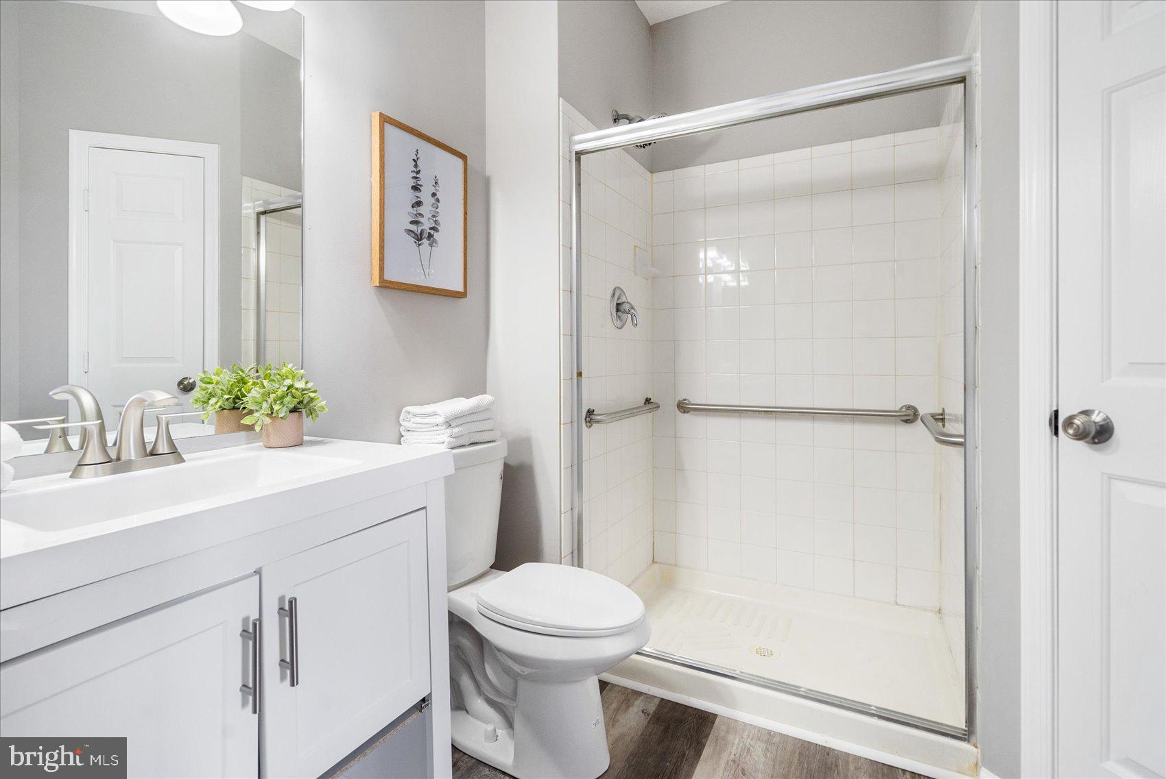 5386 Glenthorne Court, Unit 5386 Baltimore, MD 21237 - Photo 20 of 36 a bathroom with a sink toilet and shower