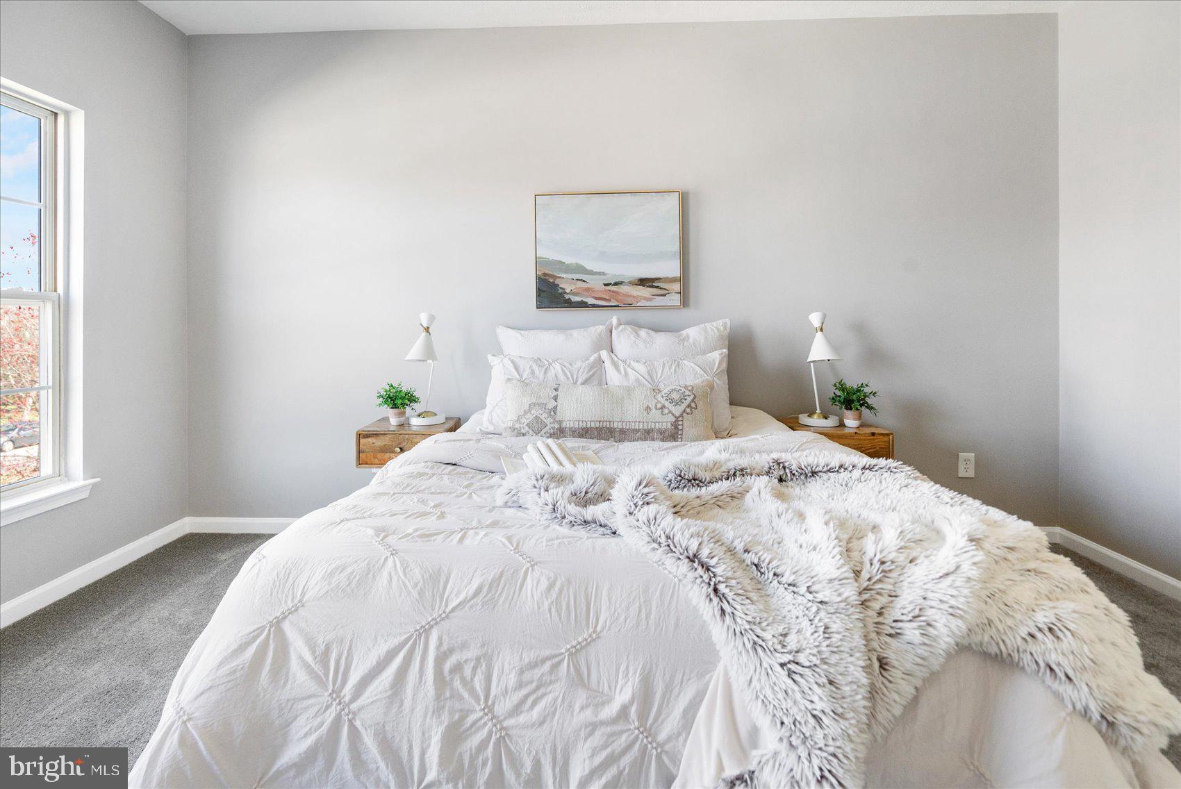 5386 Glenthorne Court, Unit 5386 Baltimore, MD 21237 - Photo 26 of 36 a bedroom with a bed and a window