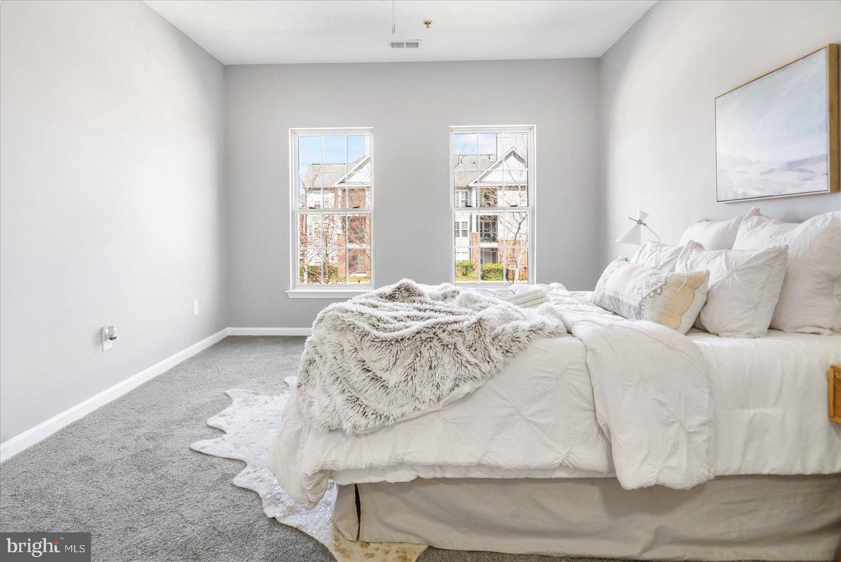 5386 Glenthorne Court, Unit 5386 Baltimore, MD 21237 - Photo 27 of 36 a large white bed in a white room