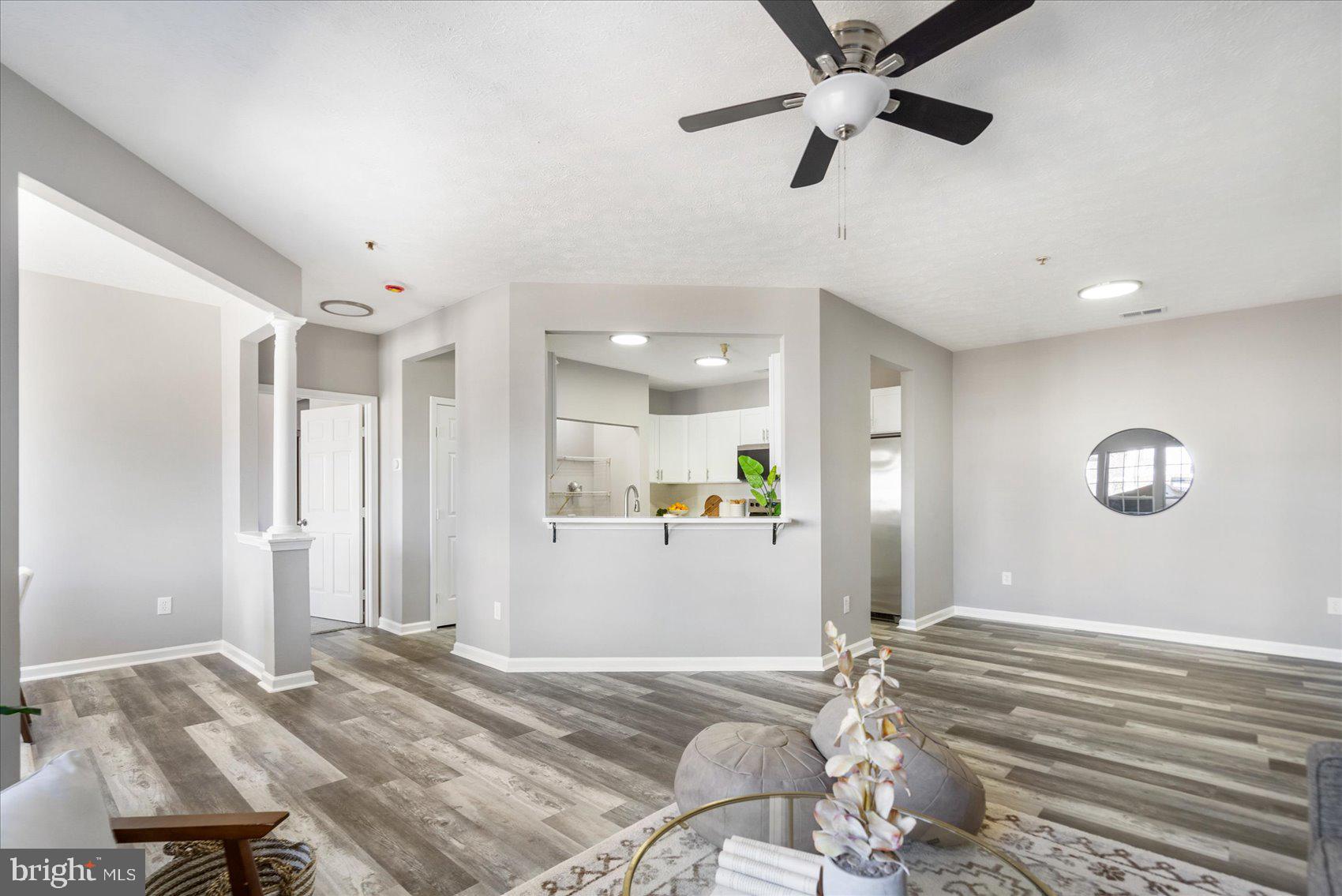 5386 Glenthorne Court, Unit 5386 Baltimore, MD 21237 - Photo 6 of 36 a bedroom with a bed chandelier and a window