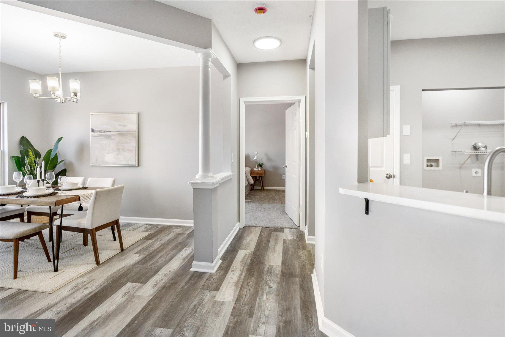 5386 Glenthorne Court, Unit 5386 Baltimore, MD 21237 - Photo 7 of 36 a view of a living room and a wooden floor