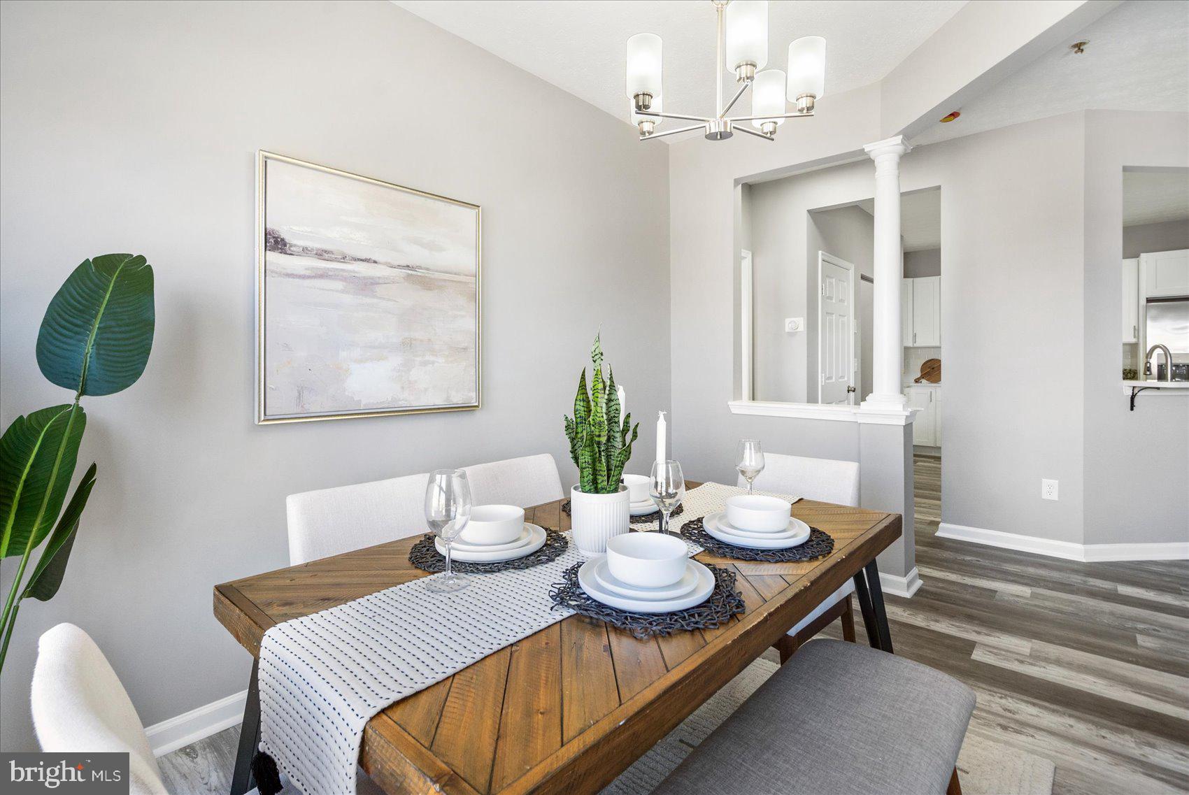 5386 Glenthorne Court, Unit 5386 Baltimore, MD 21237 - Photo 9 of 36 a dining room with furniture and window