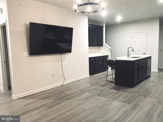 a view of living room with furniture and flat screen tv