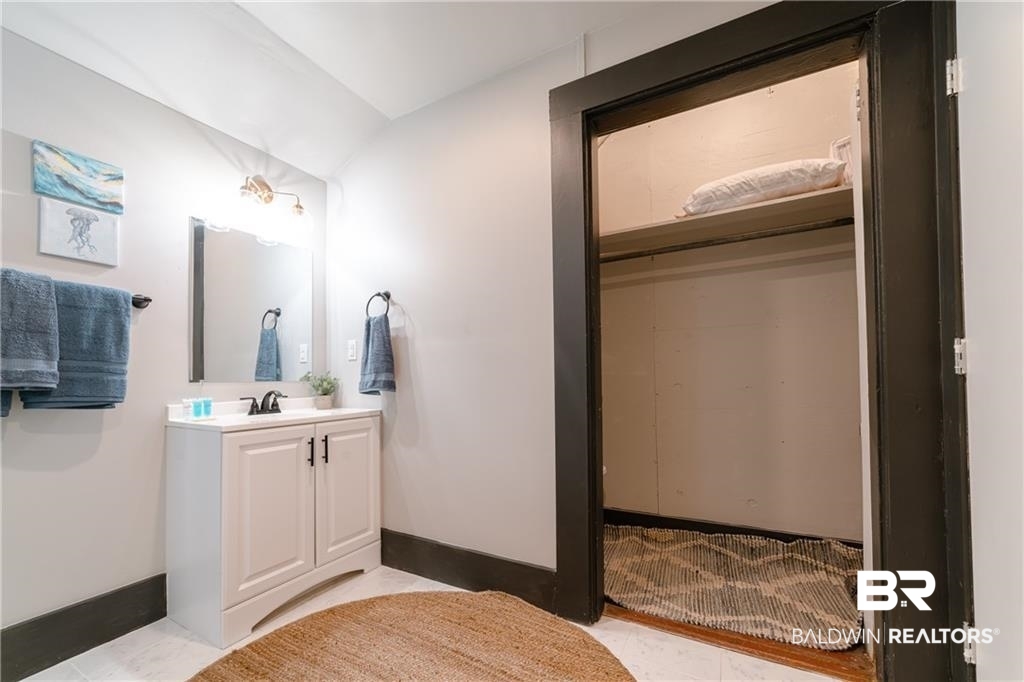 207 Michigan Avenue Mobile, AL 36604 - Photo 26 of 31 Bathroom with vanity and lofted ceiling