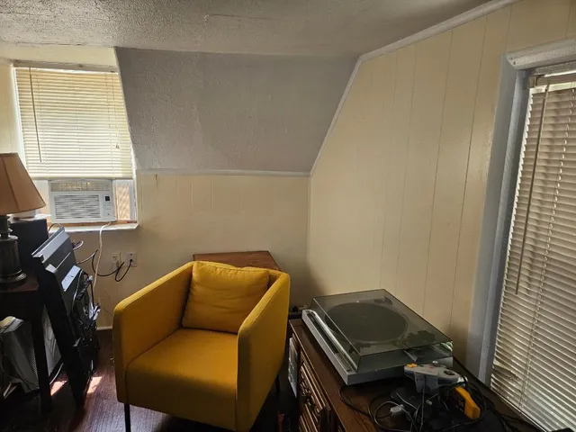 a blue room with furniture and a window