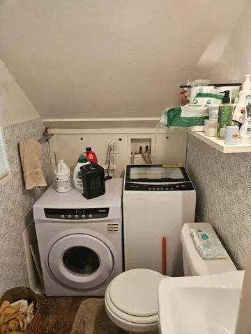 a bathroom with a toilet and a sink