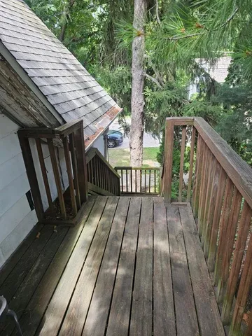 a view of deck with wooden floor and outdoor seating