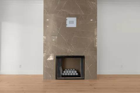 a bathroom with a shower and a glass door