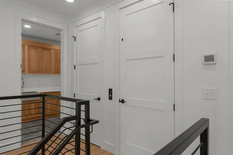 a kitchen with stainless steel appliances white cabinets and a sink