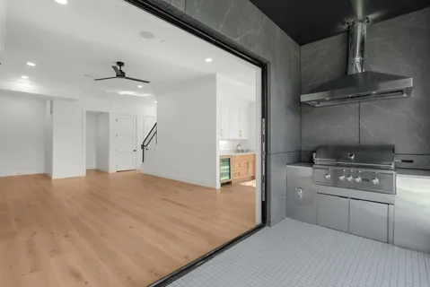 a kitchen with a stove and a refrigerator