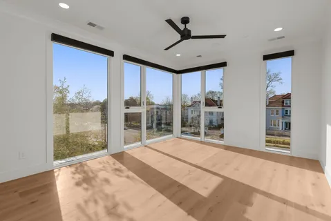 a spacious bathroom with a tub sink shower and mirror