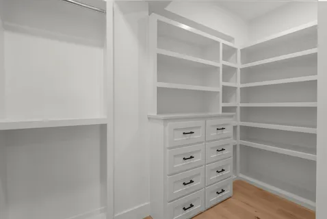 a bathroom with a shower sink and mirror