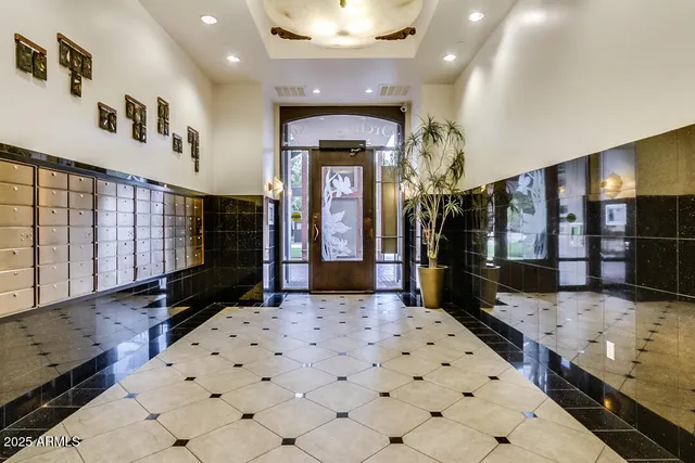 a view of a hallway with wooden floor and windows