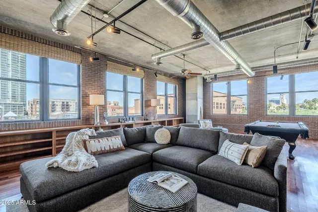 a living room with furniture and a large window