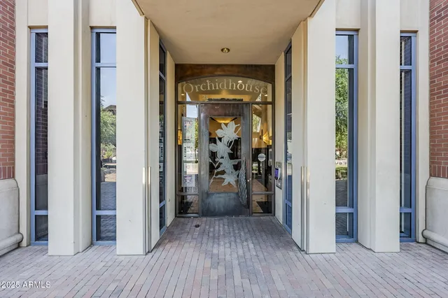 a view of a hallway view with wooden floor and staircase