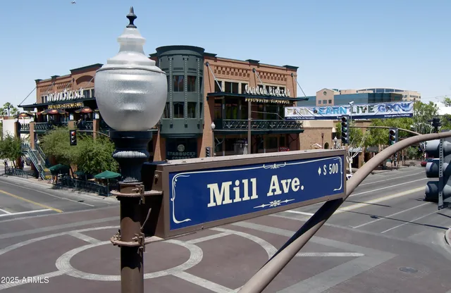a front view of a house with sitting area and garden