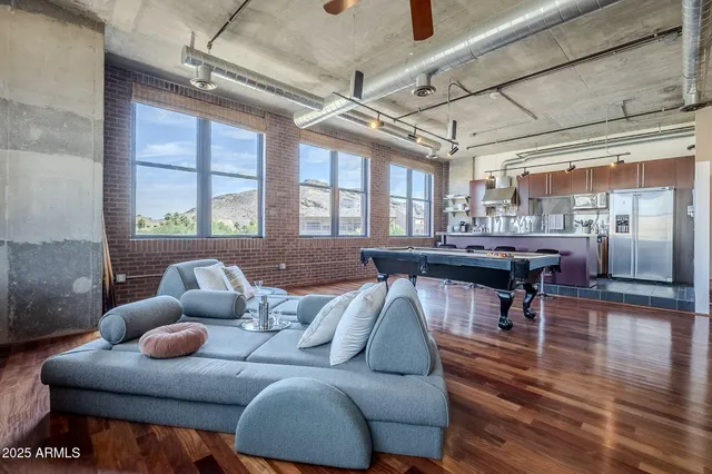 a living room with furniture and a large window