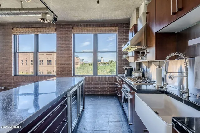 a kitchen with large windows
