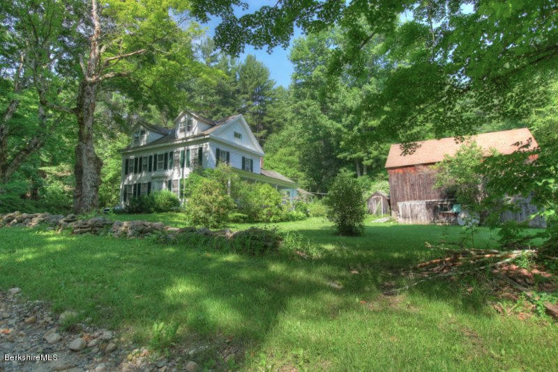 66 Fox Road Sandisfield, MA 01255 - Photo 2 of 54 a front view of a house with a yard