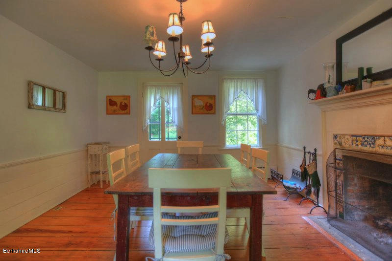 66 Fox Road Sandisfield, MA 01255 - Photo 17 of 54 a view of a dining room with furniture and wooden floor