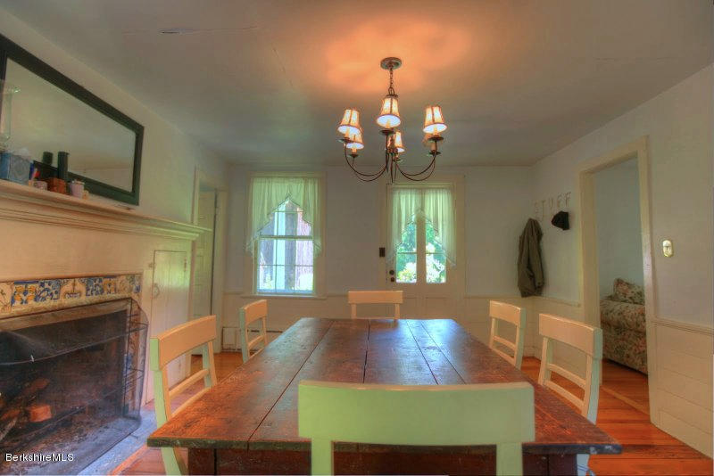 66 Fox Road Sandisfield, MA 01255 - Photo 18 of 54 a view of a dining room with furniture and wooden floor